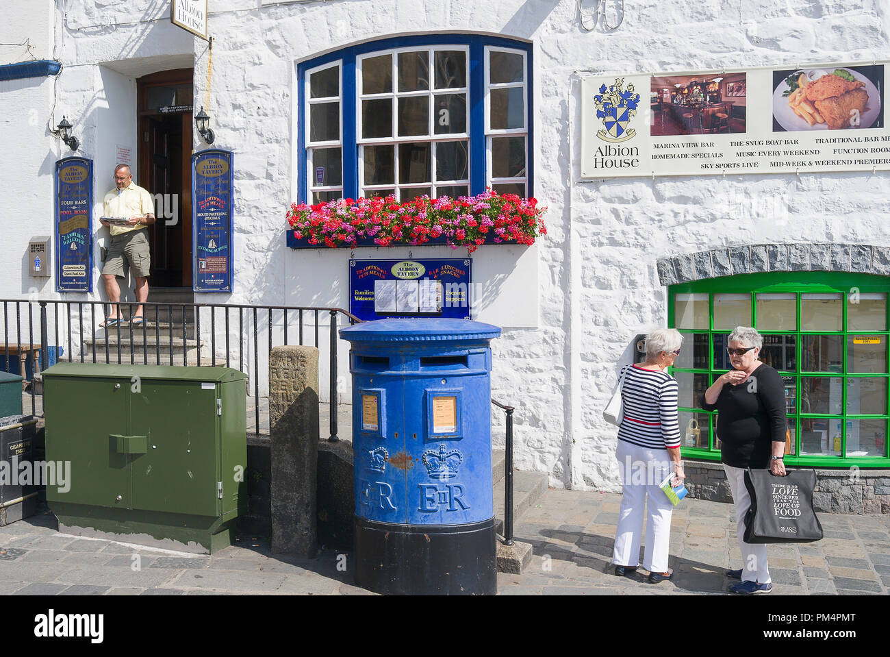 Outside The Albion House Tavern in St Peter Port Guernsey UK with a few local people Stock Photo
