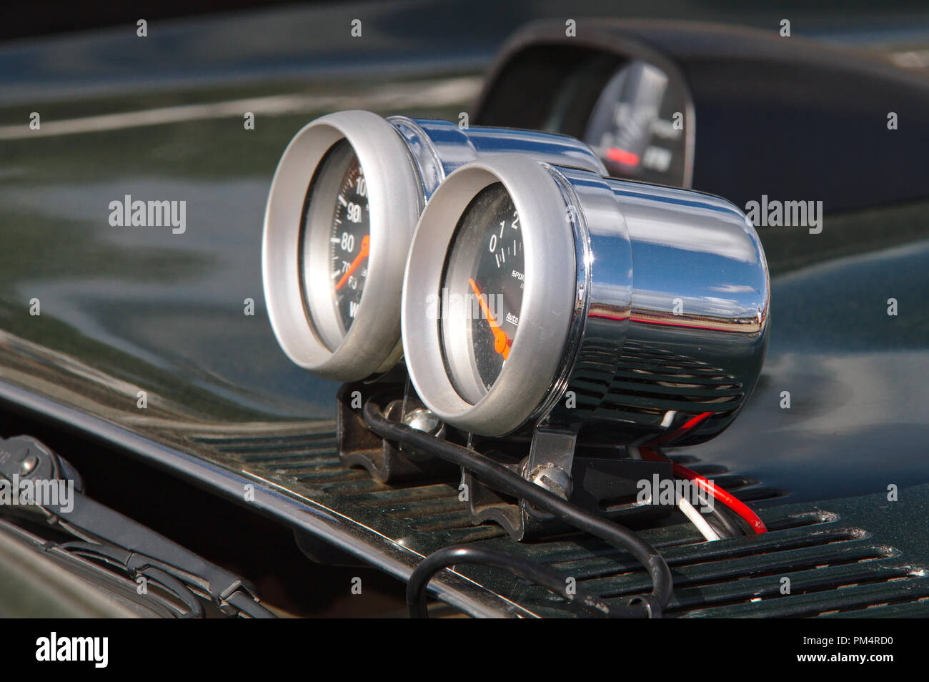 External gauges outside on the hood of a modified car. Stock Photo