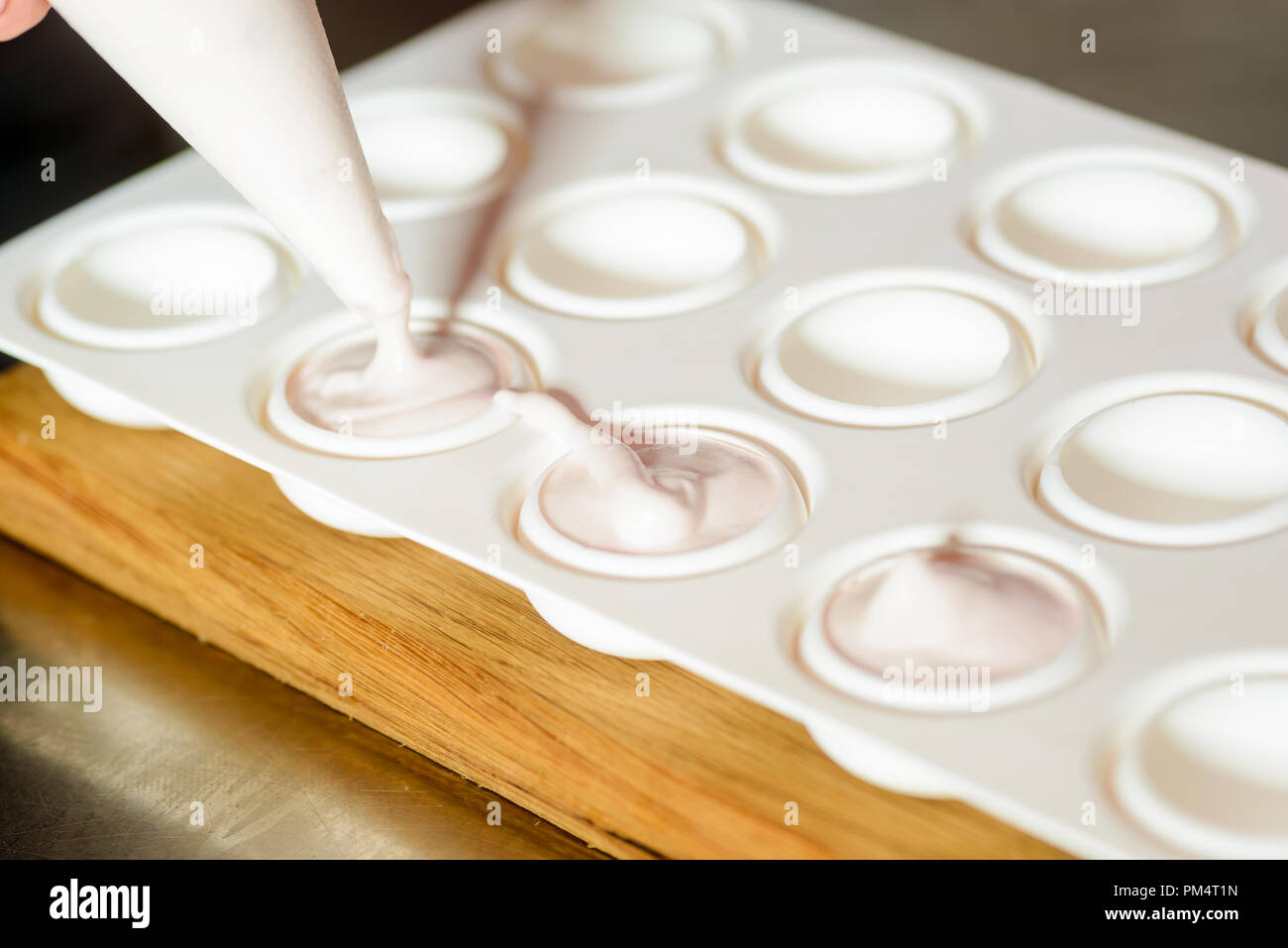 Silicone mold with white mousse Stock Photo Alamy