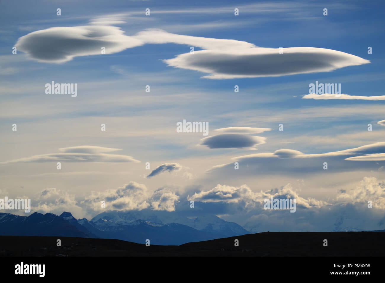 Impressive white and grey clouds on the autumn evening sky in Patagonia, Argentina Stock Photo