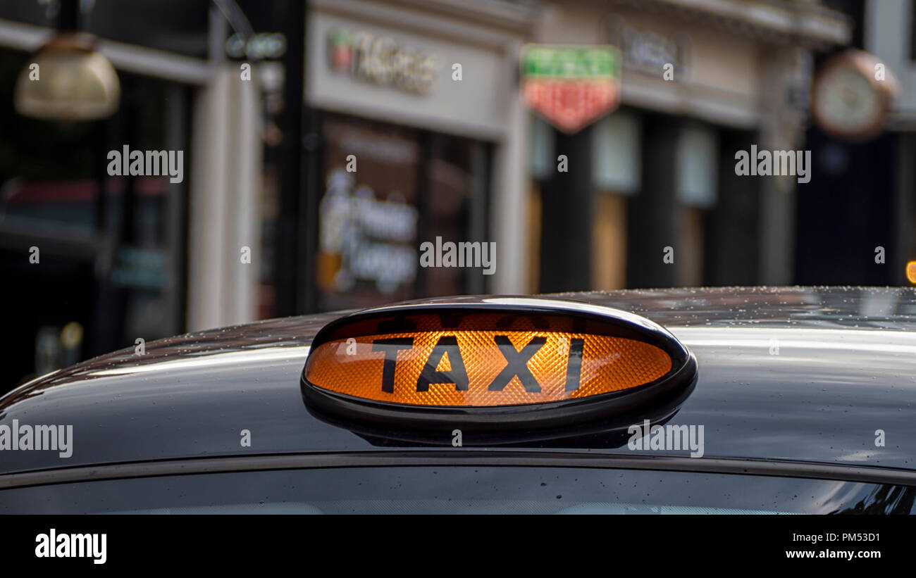 LONDON, UK - AUGUST 25, 2018:  Taxi Sign on London Black Taxi Cab in the West End Stock Photo