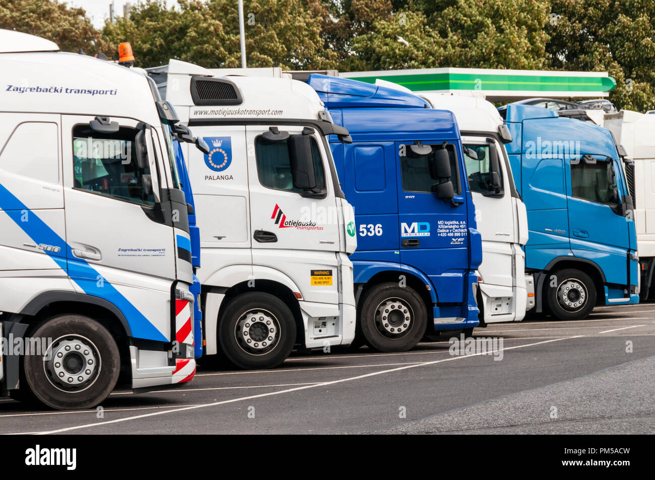 European lorries or trucks lined up at the Medway motorway services on the M2 Stock Photo