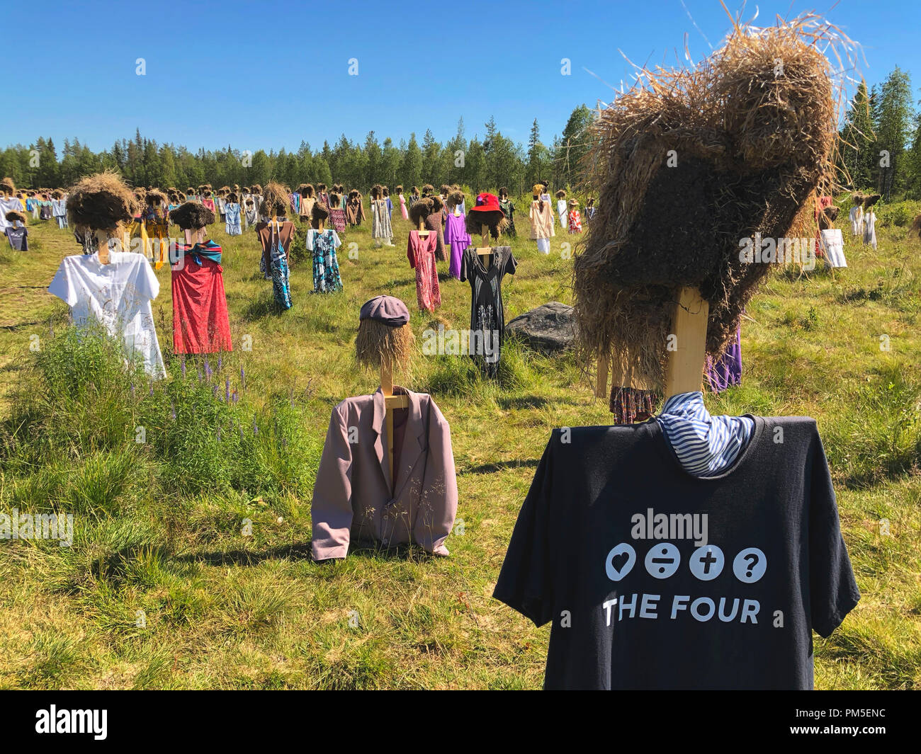 SUOMUSSALMI, FINLAND - JULY 10, 2018: Silent People is work of art by artist Reijo Kela. This work include about thousand scarecrow. Silent People mov Stock Photo