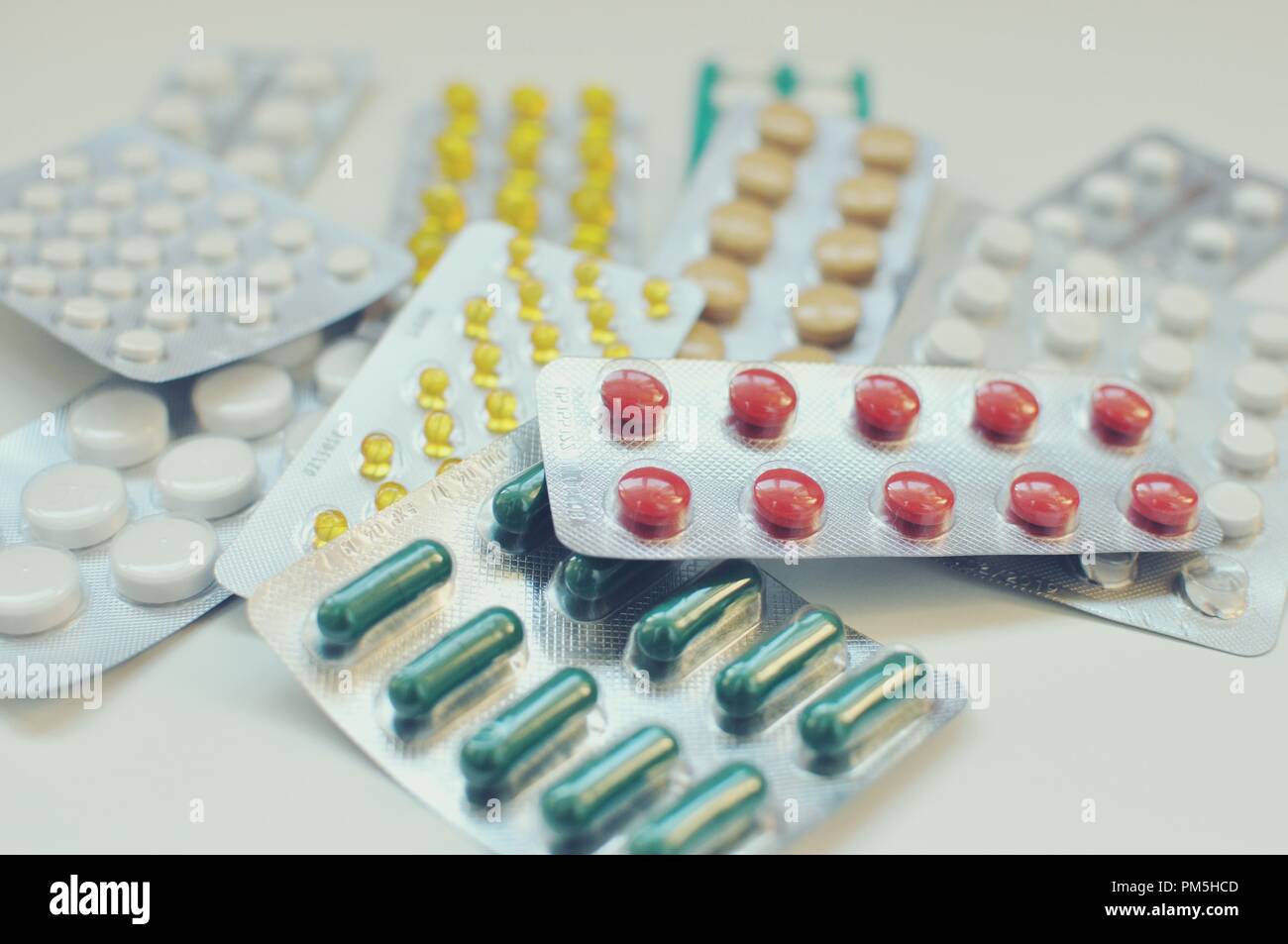 Concept of a close up view of blisters with colored pills, medicine capsules. Medicament (medicine) for health care prescription. Stock Photo