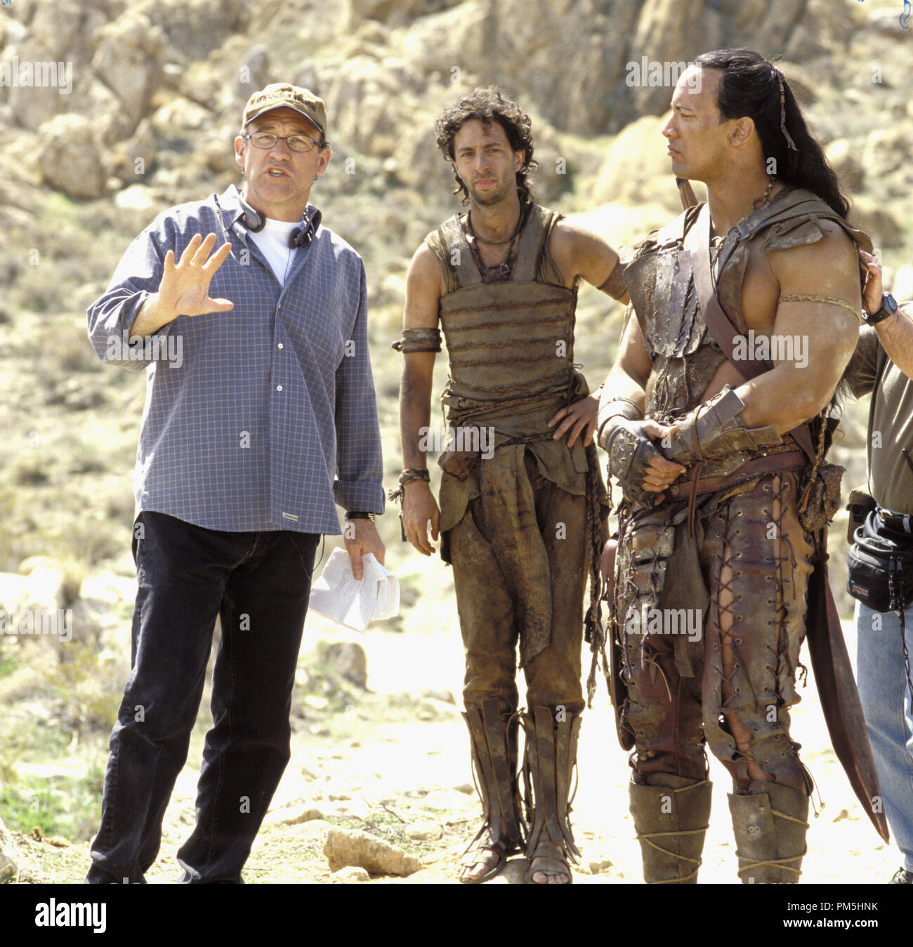 Film Still / Publicity Still from 'The Scorpion King' Director Chuck Russell, Grant Heslov, The Rock (aka Dwayne Douglas Johnson) © 2002 Universal Studios Photo Credit: Darren Michaels File Reference # 30754279THA  For Editorial Use Only -  All Rights Reserved Stock Photo