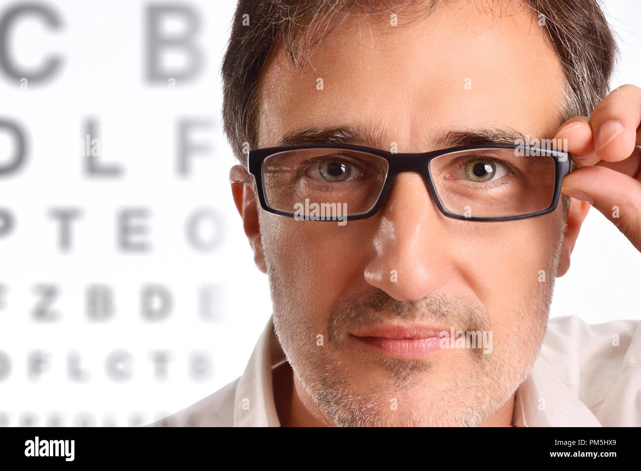 Attractive man with eye corrective glasses in consultation. Horizontal composition Stock Photo