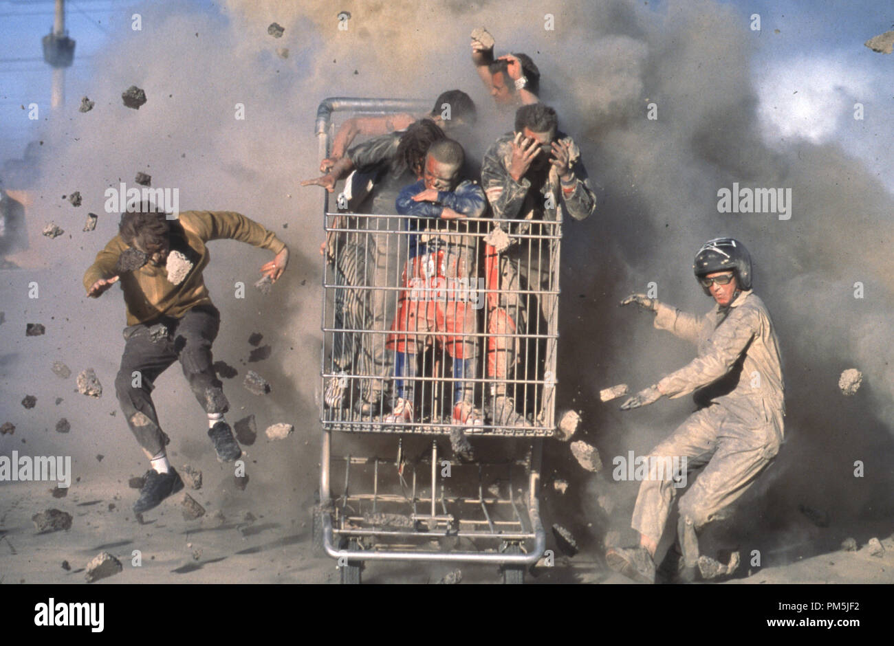 Film Still / Publicity Still from 'Jackass: The Movie' (left) Dave England, (right) Ehren McGhehey, (in shopping cart, beginning center clockwise) Jason 'Wee Man' Acuna, Bam Margera, Ryan Dunn, Steve-O, Chris Pontius, and Johnny Knoxville © 2002 MTV Films Stock Photo