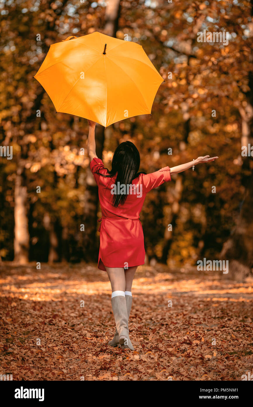 in a red dress and alone 3,240 Woman Red Dress Sitting Alone Stock Photos