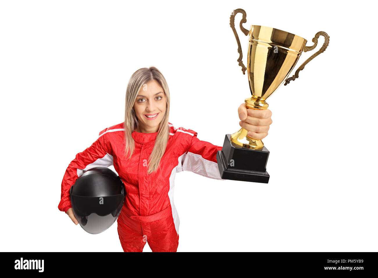 Woman racer in a suit holding a gold trophy cup isolated on white background Stock Photo