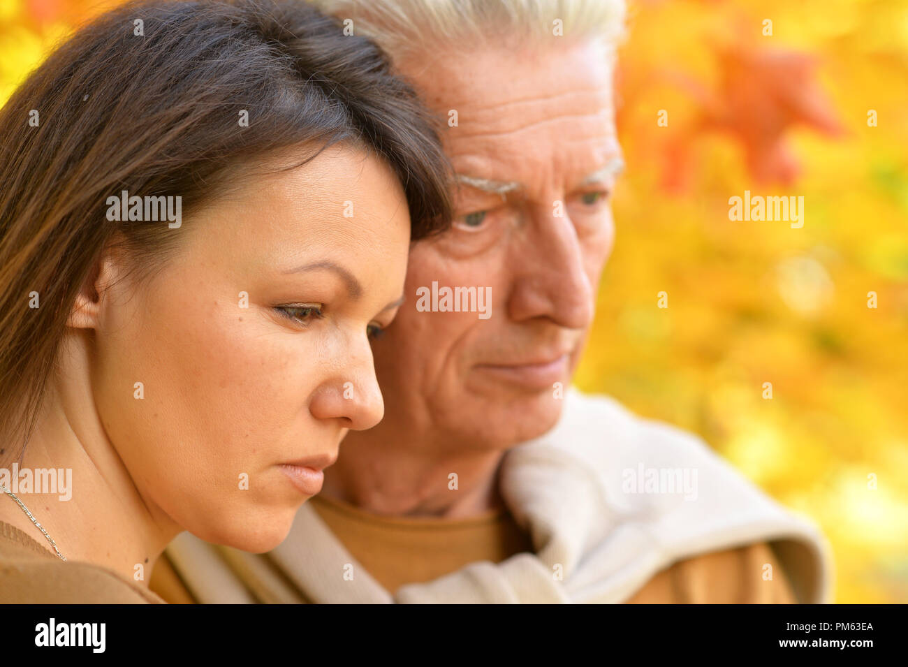 Woman hugging father unhappy hi-res stock photography and images - Alamy