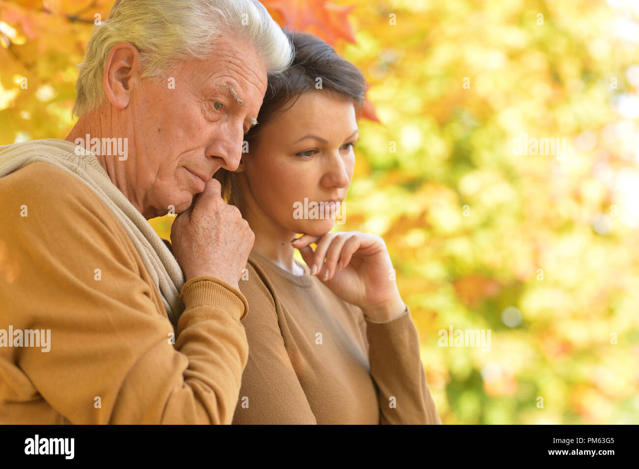 Woman hugging father unhappy hi-res stock photography and images - Alamy