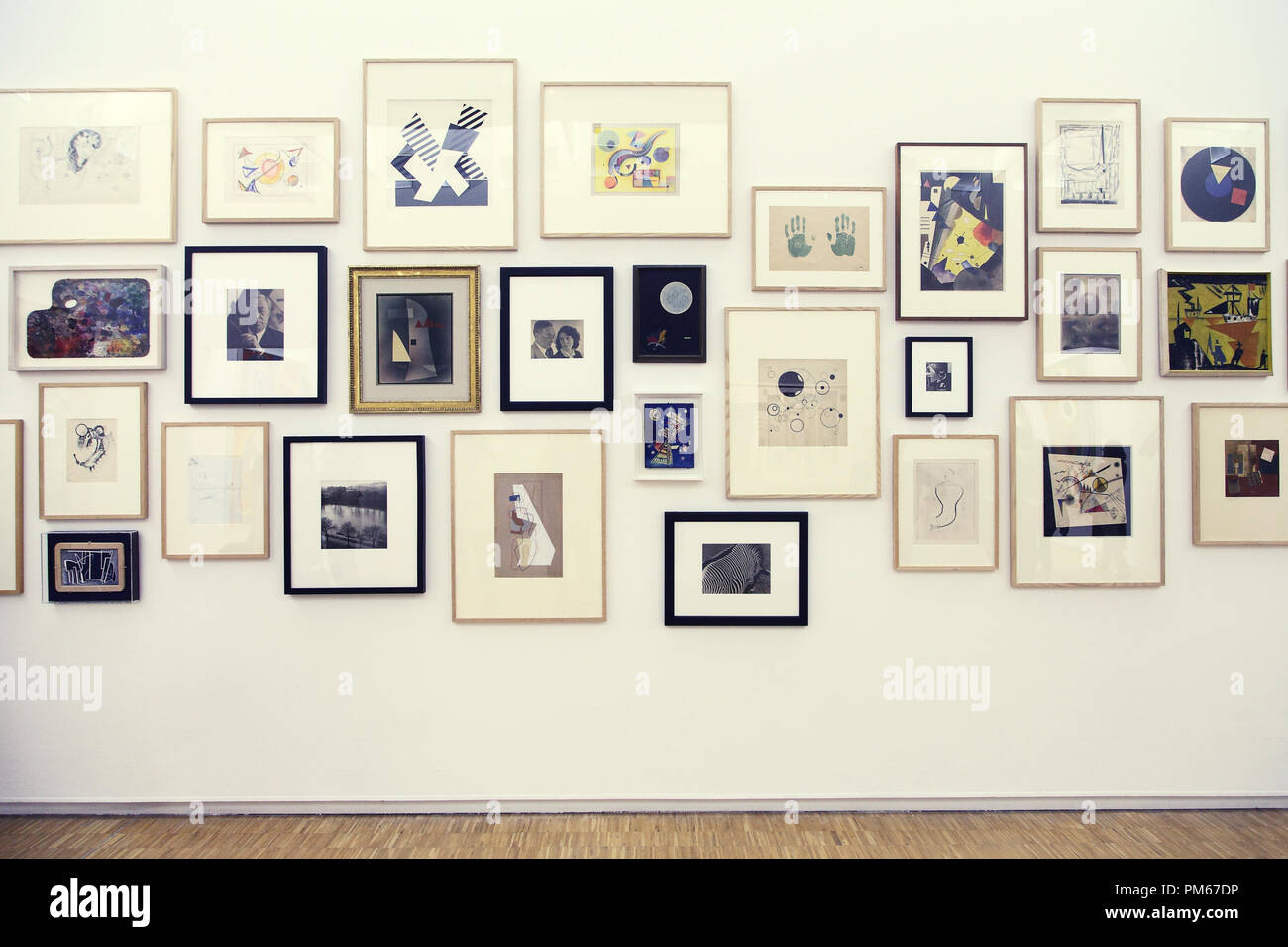 Many paintings on the wall in Modern Art museum Stock Photo Alamy