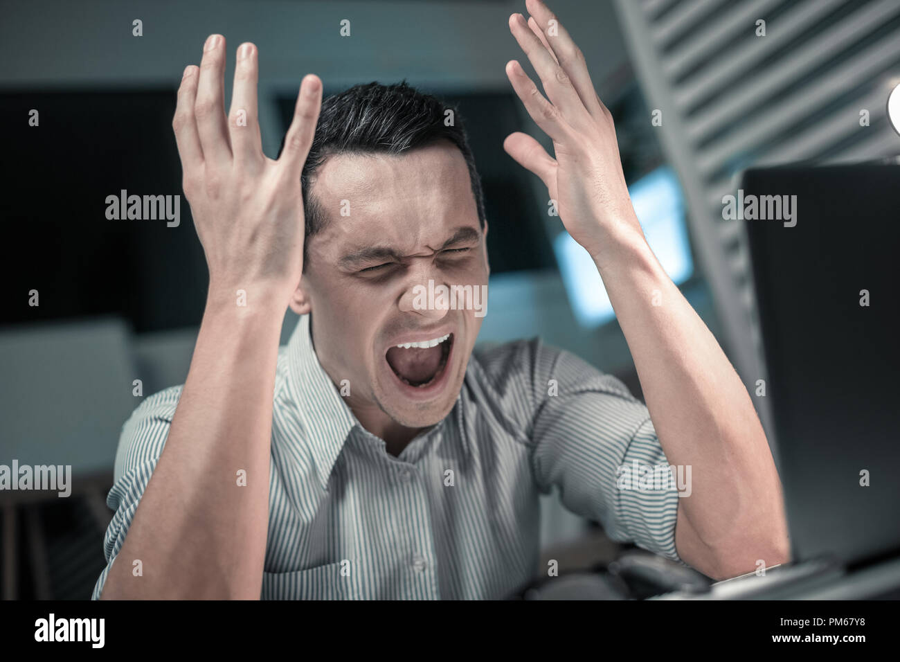 Young business man stressed out at work Stock Photo