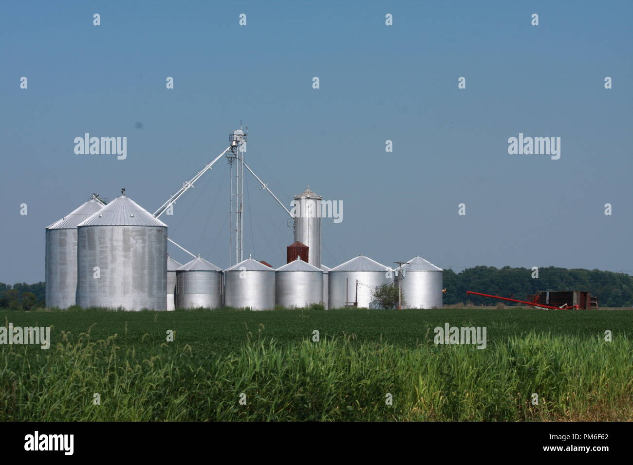 Farmer's Grain Storage Bins on farmland Stock Photo Alamy