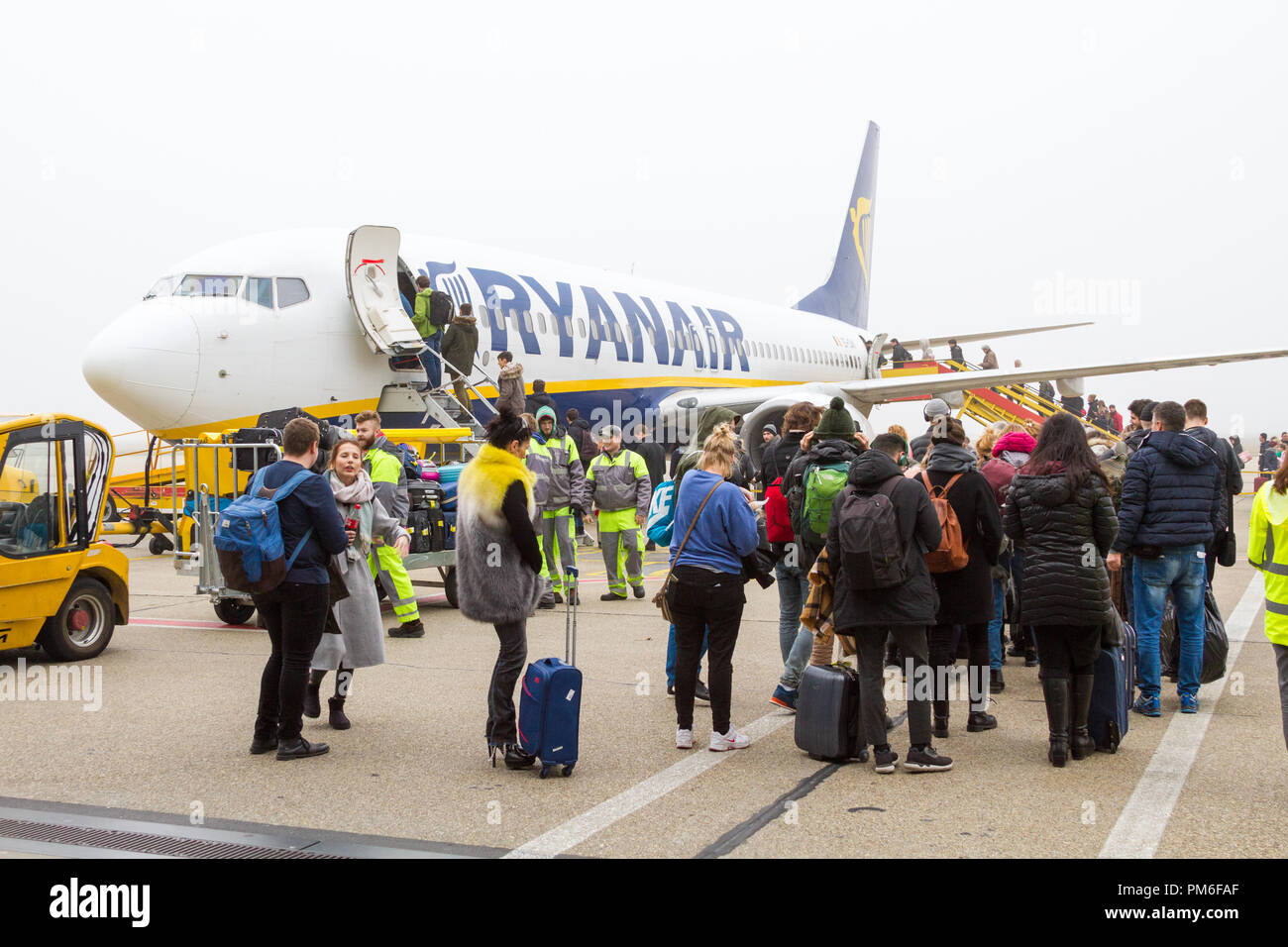 Bratislava, Slovakia. 8 January 2018. A Ryanair Boeing 737-800 aircraft parked at the Bratislava airport runway. People are boarding the plane. Stock Photo