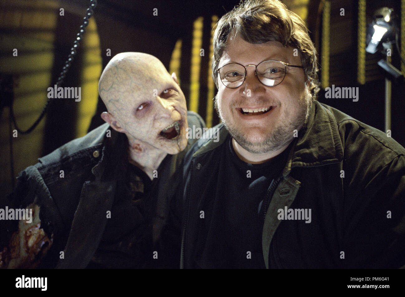 Film Still / Publicity Still from 'Blade II' Director Guillermo del Toro (rt.) with a Reaper © 2002 New Line Cinema Photo Credit: Bruce Talamon File Reference # 307541017THA  For Editorial Use Only -  All Rights Reserved Stock Photo