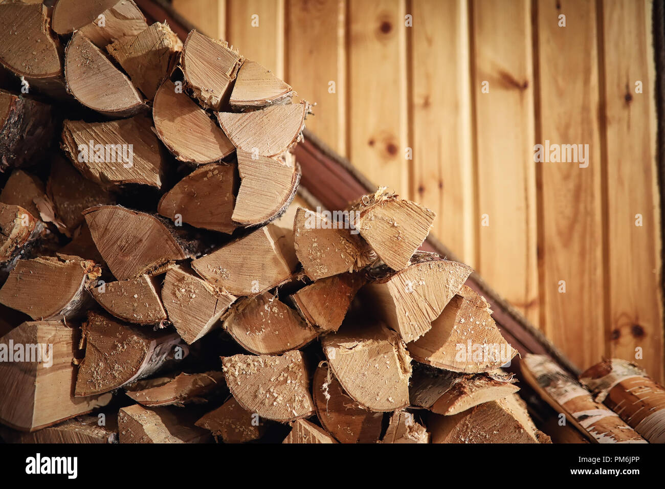 Wood burning stove. Firewood for furnace heating. Warehouse for Stock