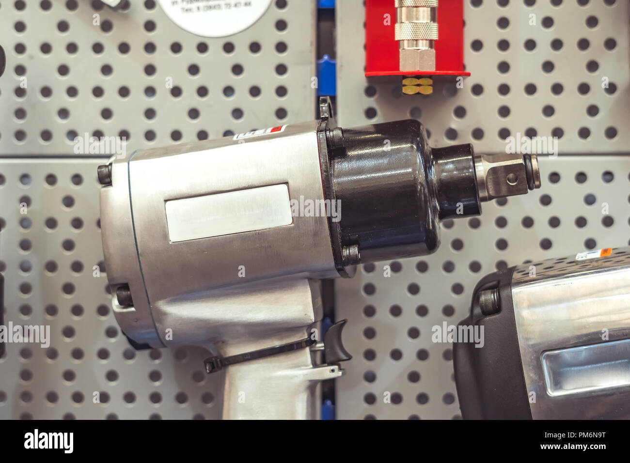 Electric tools for construction on the stand in the shop Stock Photo