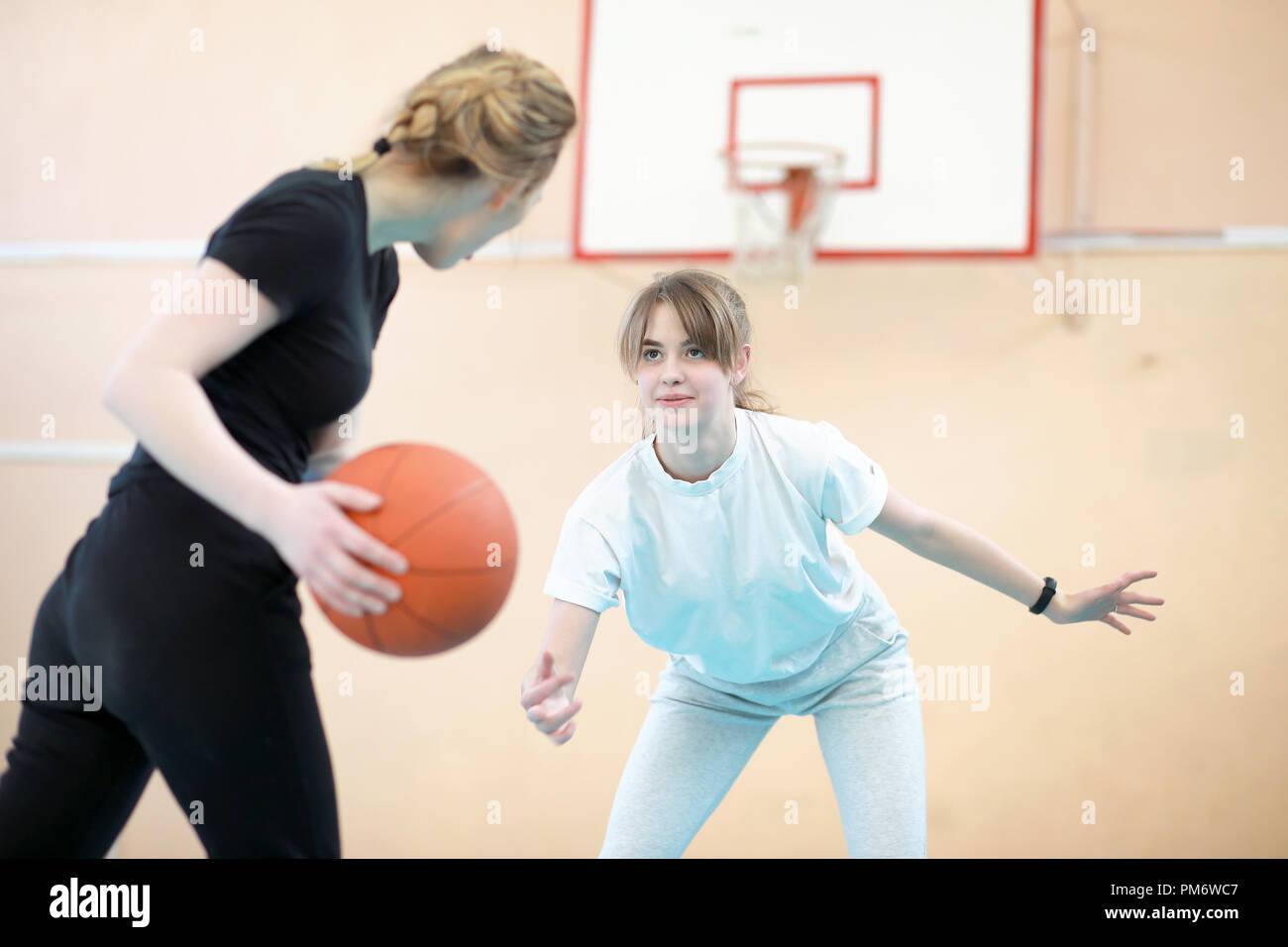 Girl in the gym playing a basketball Stock Photo Alamy