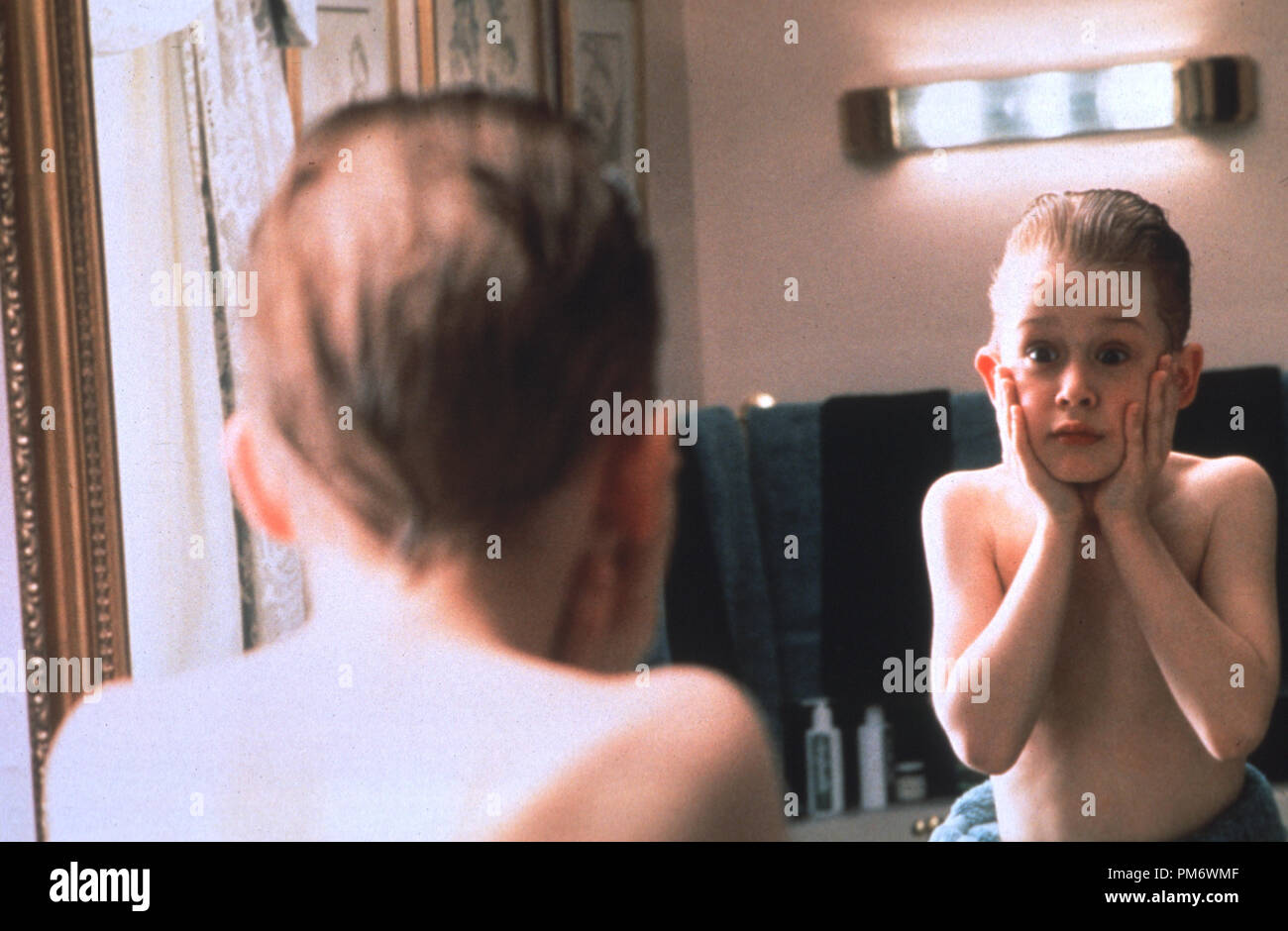 Film Still from 'Home Alone' Macaulay Culkin © 1990 20th Century Fox Photo Credit: Don Smetzer Stock Photo