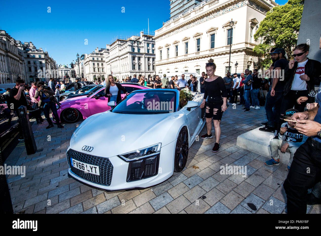 Modified Super cars seen lined up during the car show. Piccadilly boys, the super car racer club of Kream Development parades their customized car in the Kream Liberty walk M3 Edition at Waterloo Place in London. Stock Photo