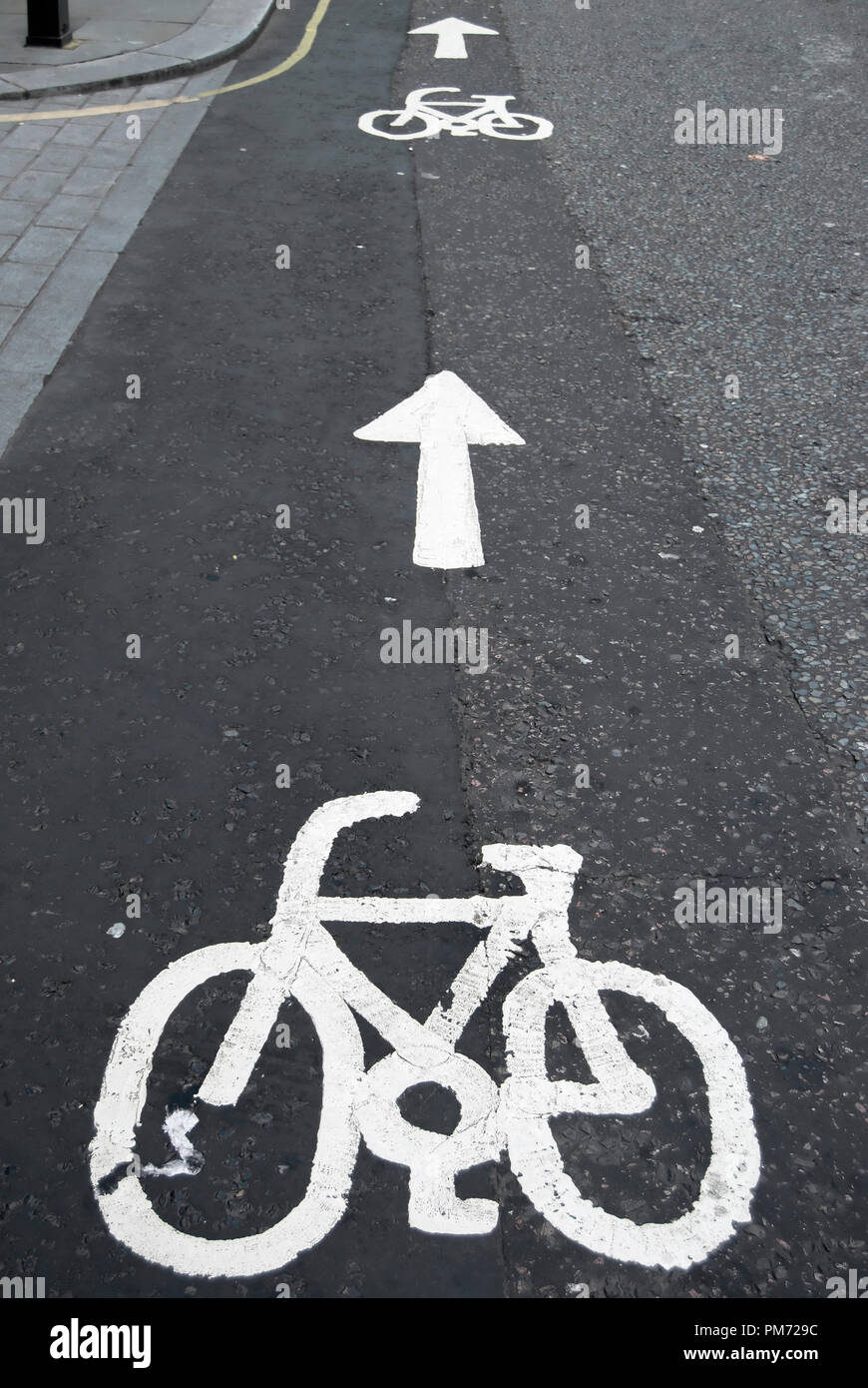 british cycle lane road markings with cycle image and arrows Stock