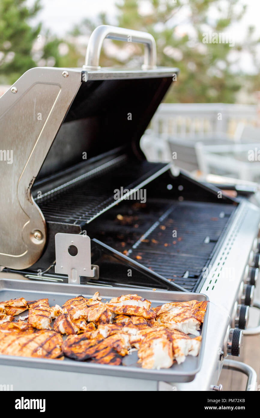 Grilling cod for fish tacos on outdoor gas grill Stock Photo Alamy