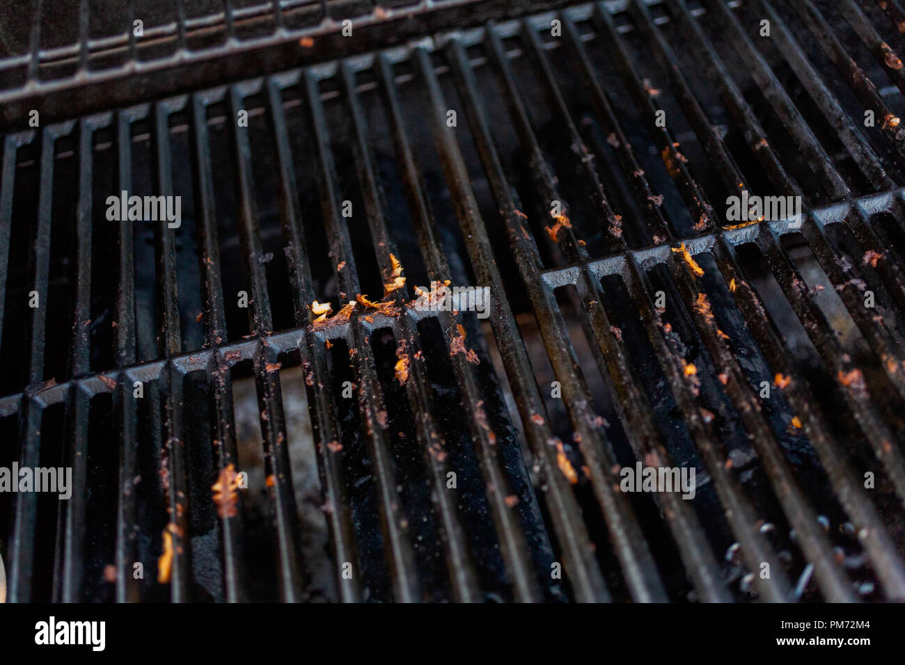 Dirty cast iron cooking grates on outdoor gas grill Stock Photo Alamy