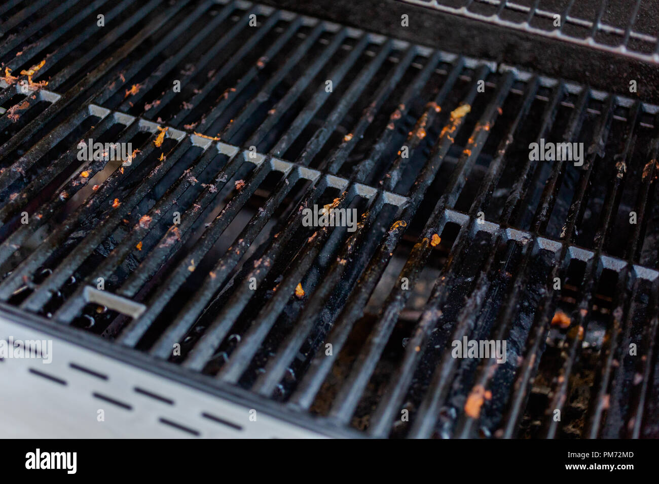 Dirty cast iron cooking grates on outdoor gas grill Stock Photo Alamy