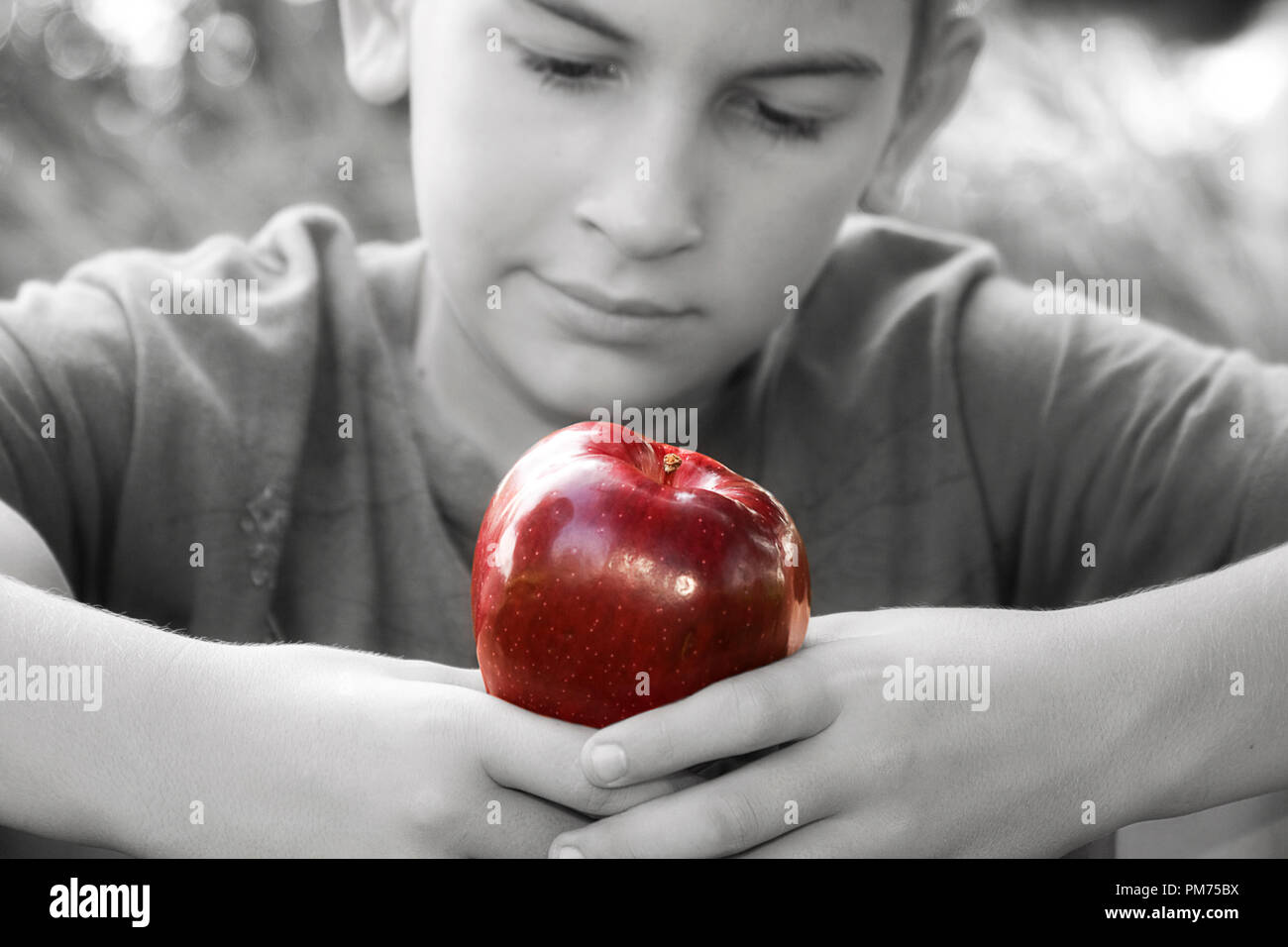Boy Thrilled With Bright Red Apple Some Images Red Apple Is Selected In Black And White Stock Photo Alamy