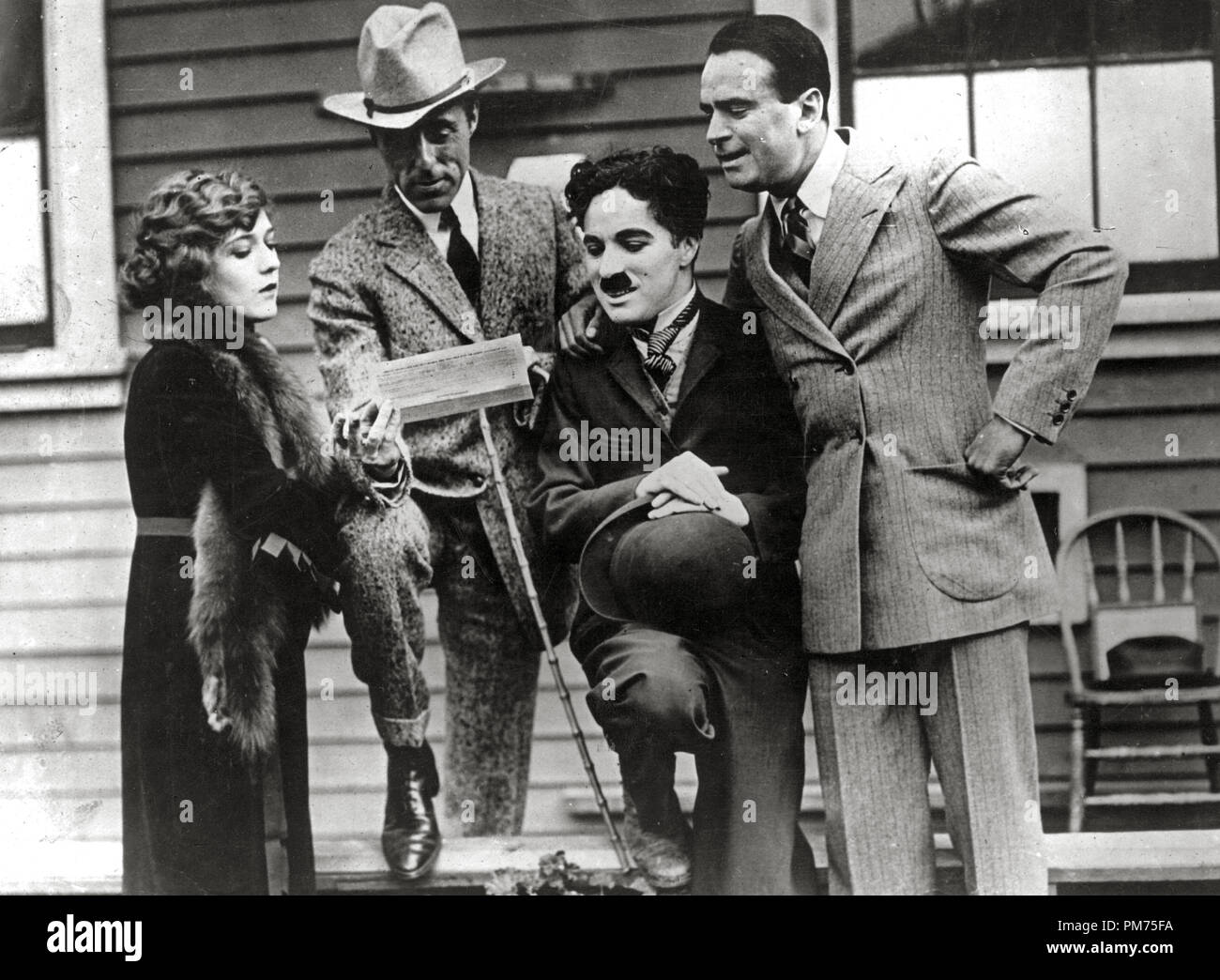Mary Pickford, D.W. Griffith, Charles Chaplin and Douglas Fairbanks  on the day they formed United Artists Corporation, 1919.  File Reference # 30928 549THA Stock Photo