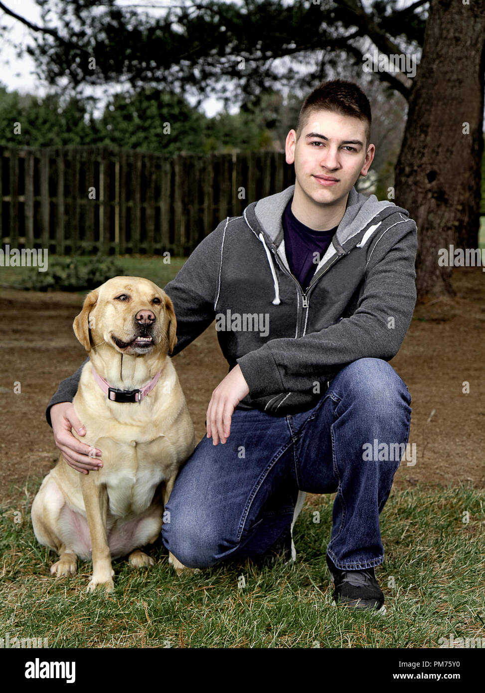 Handsome High School Senior in an assortment of poses for his senior photo shoot including outdoor and by his car shots. Stock Photo
