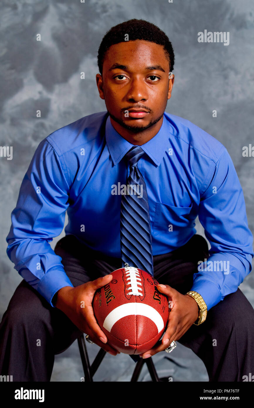 Senior High School Football player posing with football Stock Photo Alamy