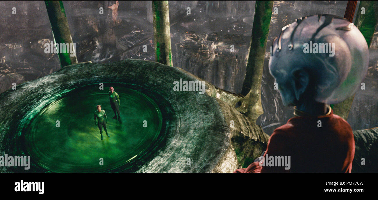 Green Lantern, played by RYAN REYNOLDS, and Sinestro, played by MARK STRONG, speak to a Guardian of the Green Lantern Corps, in Warner Bros. Pictures' action adventure 'GREEN LANTERN,' a Warner Bros. Pictures release. Stock Photo