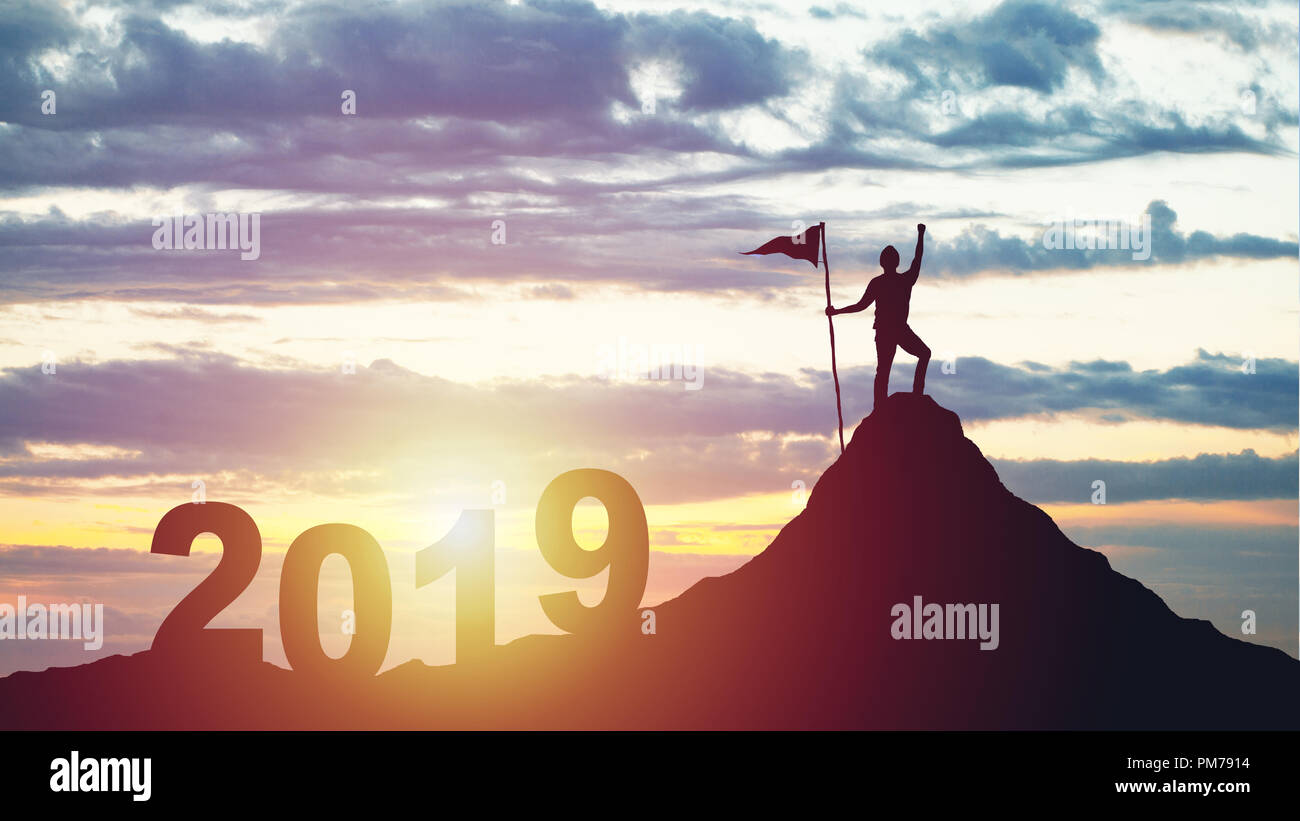 silhouette of man with flag on mountain top over sunset Stock Photo - Alamy