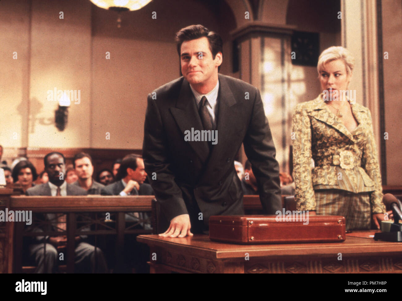 Film Still from 'Liar, Liar' Jim Carrey and Jennifer Tilly © 1997 Universal Photo Credit: Melinda Sue Gordon  File Reference # 31013258THA  For Editorial Use Only - All Rights Reserved Stock Photo