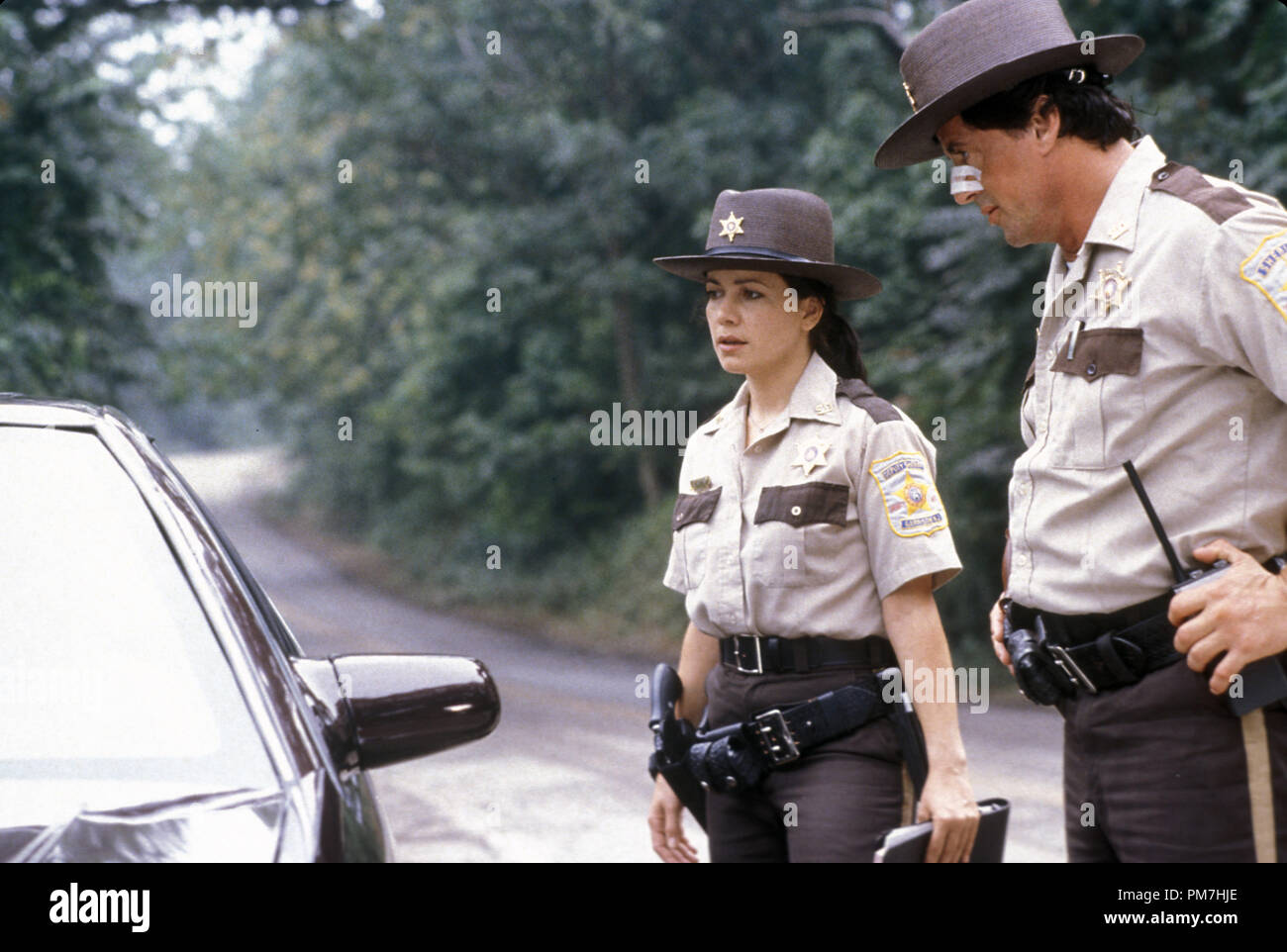 Film Still from 'Cop Land' Janeane Garofalo, Sylvester Stallone © 1997 Miramax Films Photo Credit: Sam Emerson   File Reference # 31013382THA  For Editorial Use Only - All Rights Reserved Stock Photo