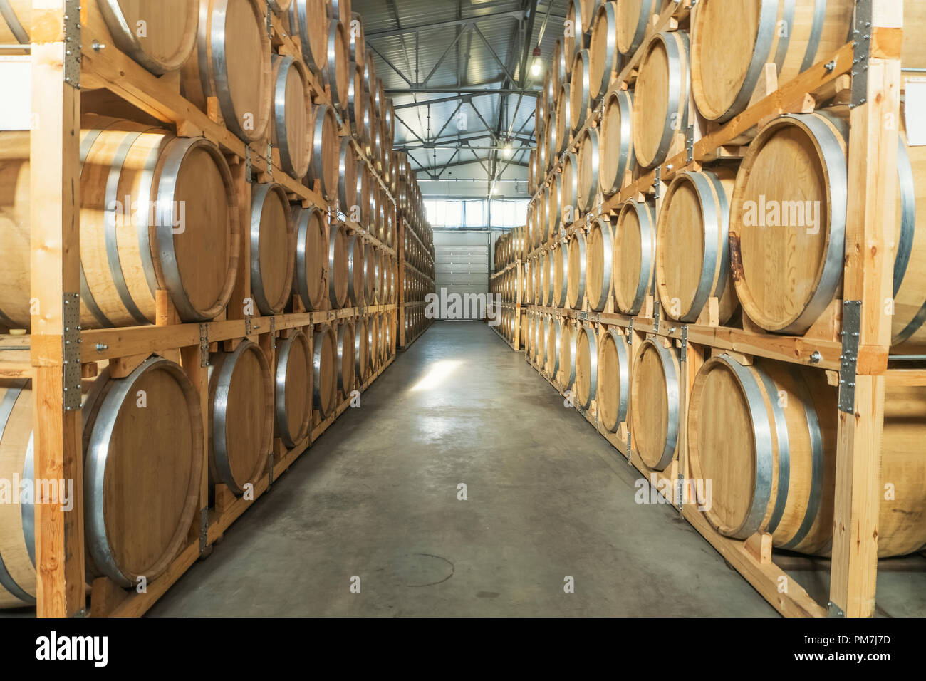 Wine barrels stacked in the old cellar of the winery Stock Photo Alamy
