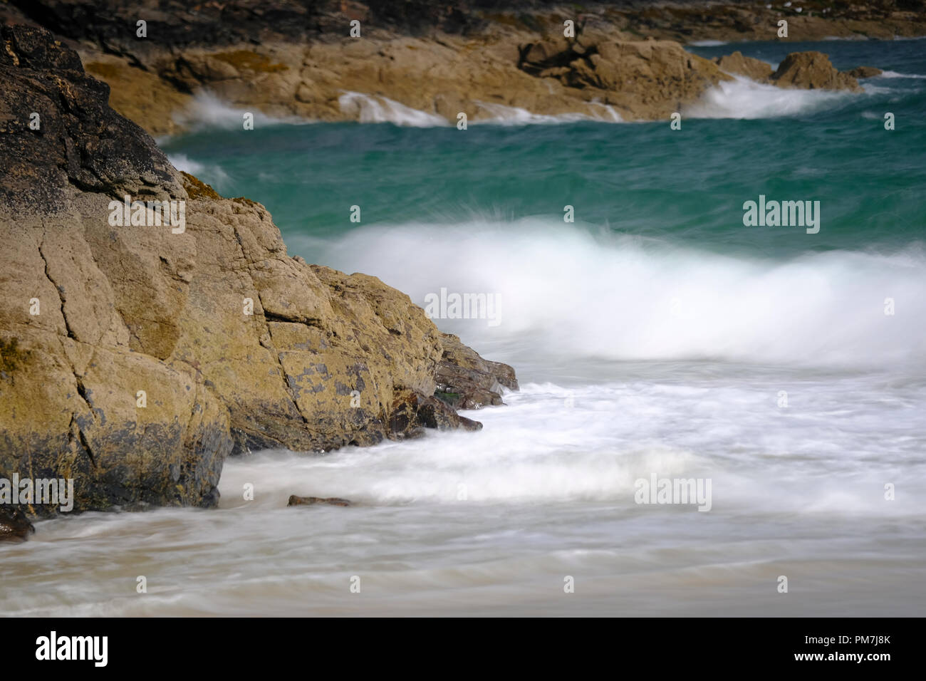 Waves crashing ashore at Carbis Bay in Cornwall Stock Photo