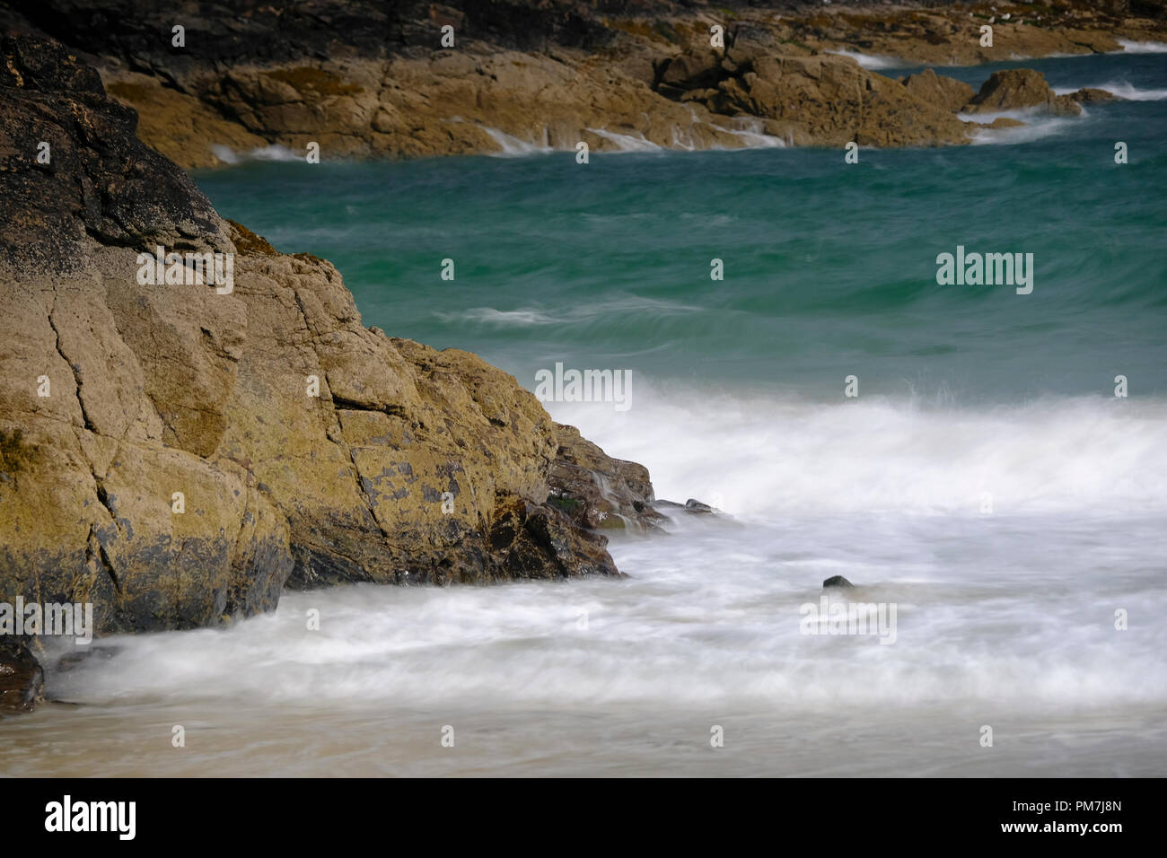 Waves crashing ashore at Carbis Bay in Cornwall Stock Photo