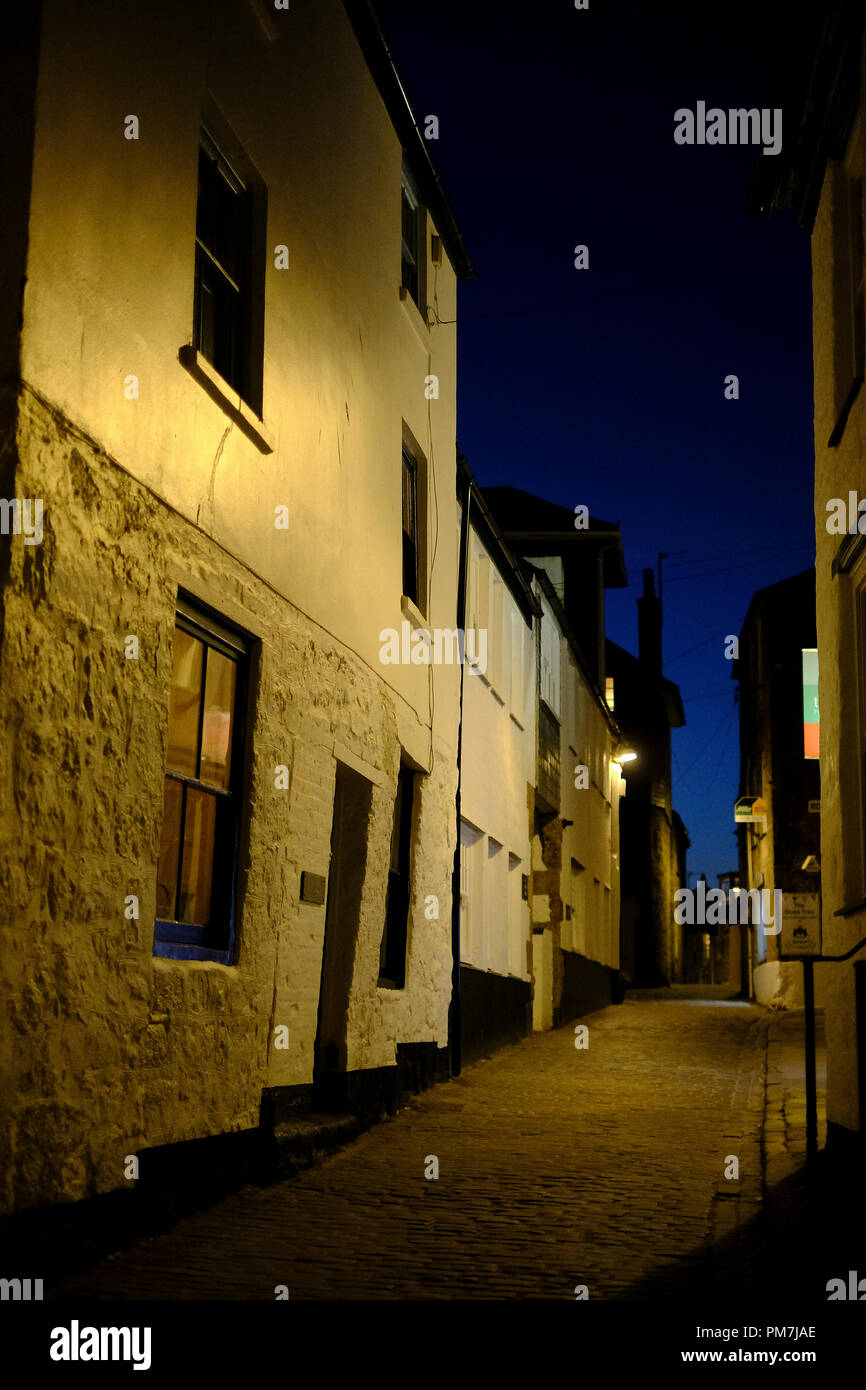Narrow street at night in St Ives in Cornwall Stock Photo