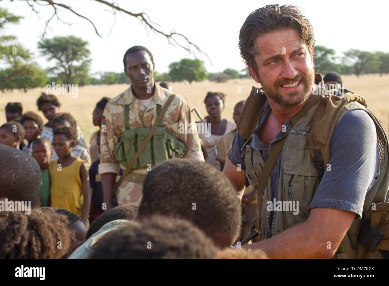 (Left to right.) Souleymane Sy Savane Deng and Gerard Butler Sam Childers save kidnapped children in the middle of territory controlled by the brutal Lords Resistance Army (LRA) in Relativity Media's release MACHINE GUN PREACHER. Stock Photo