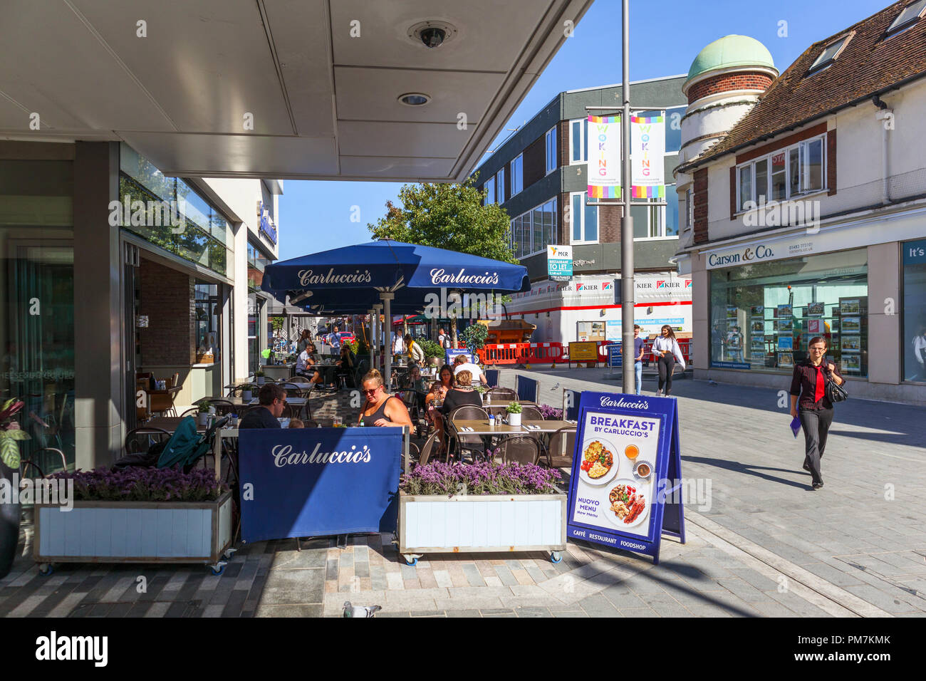 Outside street side dining at Carluccio's restaurant in pedestrianised Commercial Way, Woking town centre, Surrey, UK on a sunny day Stock Photo