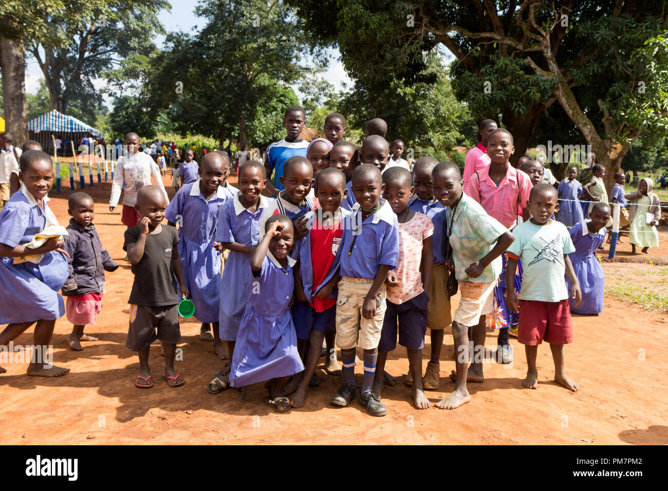 Uganda. June 30 2017. A group of happy mostly primary-school children smiling, laughing and waving. Stock Photo