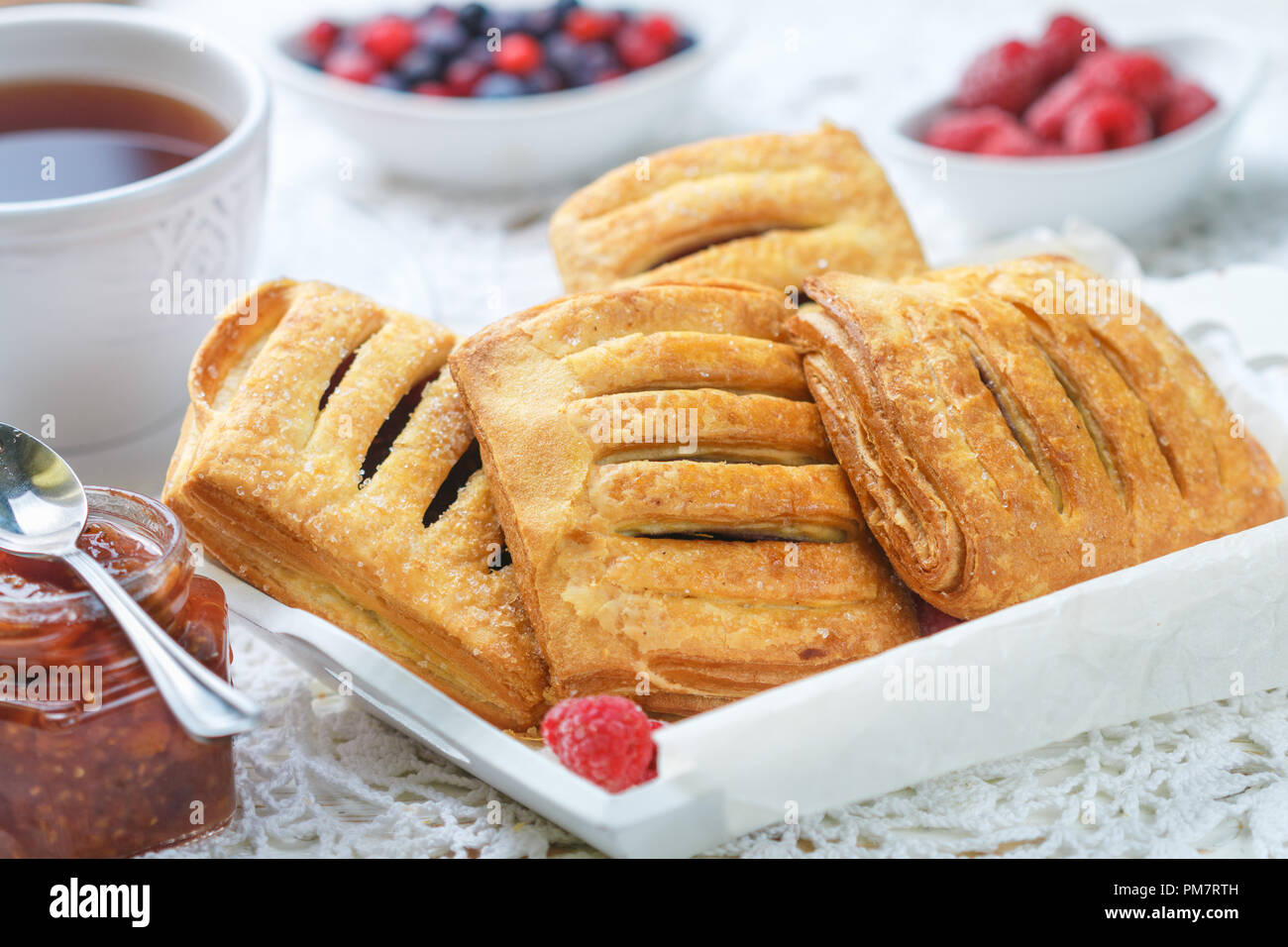 Puff Pastry Raspberry Pot Pie Homemade puff pastry pies with raspberries and blueberries. Selective ...