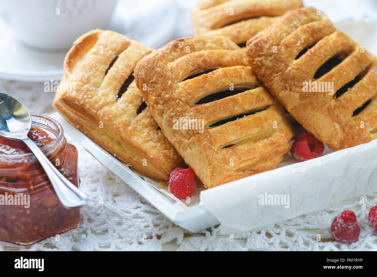 Puff Pastry Raspberry Pie Homemade puff pastry pies with raspberries and blueberries. Selective ...