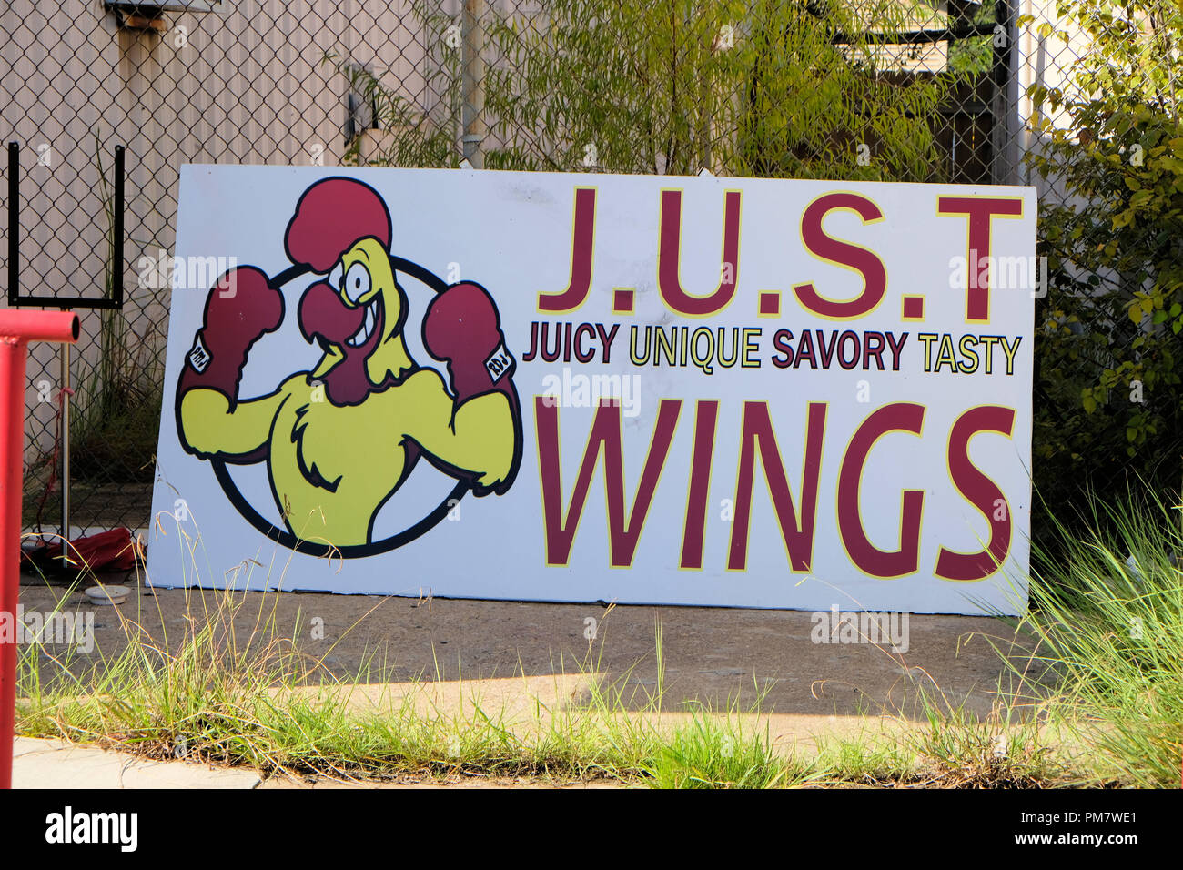 J.U.S.T. Wings storefront sign in Bryan, Texas, USA Stock Photo Alamy