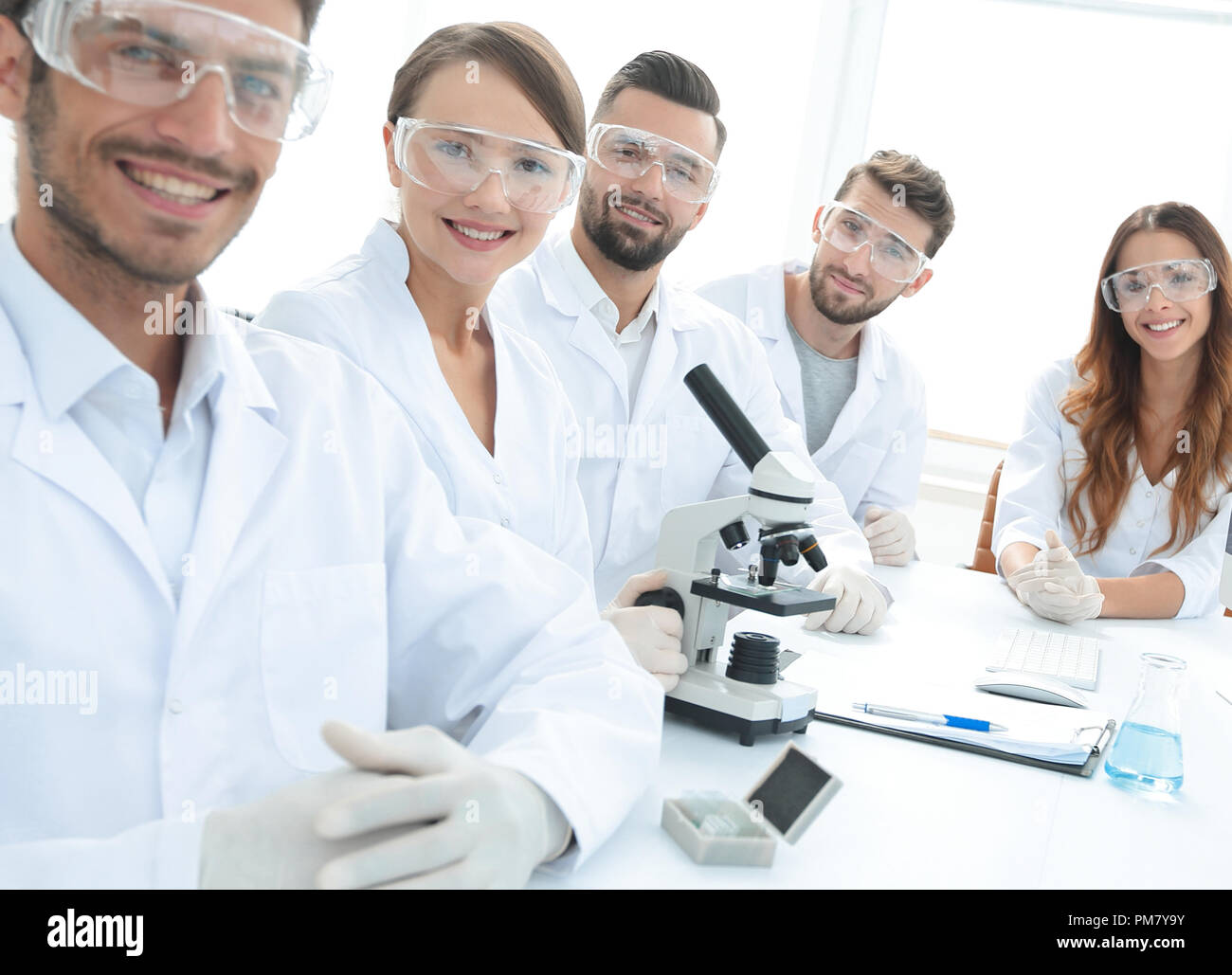 Male scientist and the team in the lab Stock Photo - Alamy
