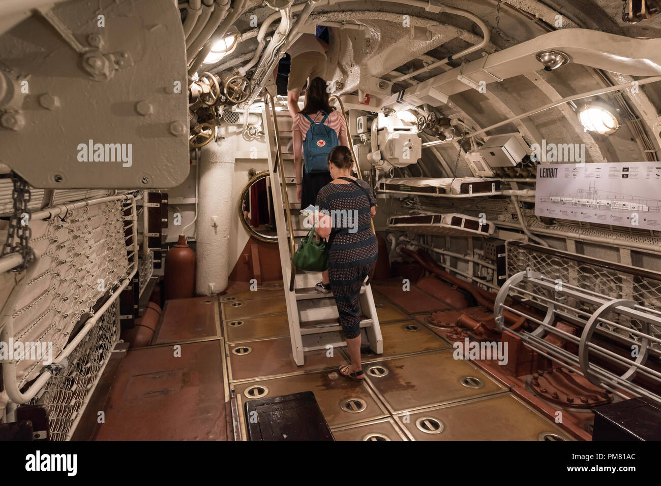 Tallinn Lennusadam, view of visitors exiting the torpedo room of the submarine 'Lembit' in the Lennusadam Seaplane Harbour Museum in Tallinn, Estonia. Stock Photo