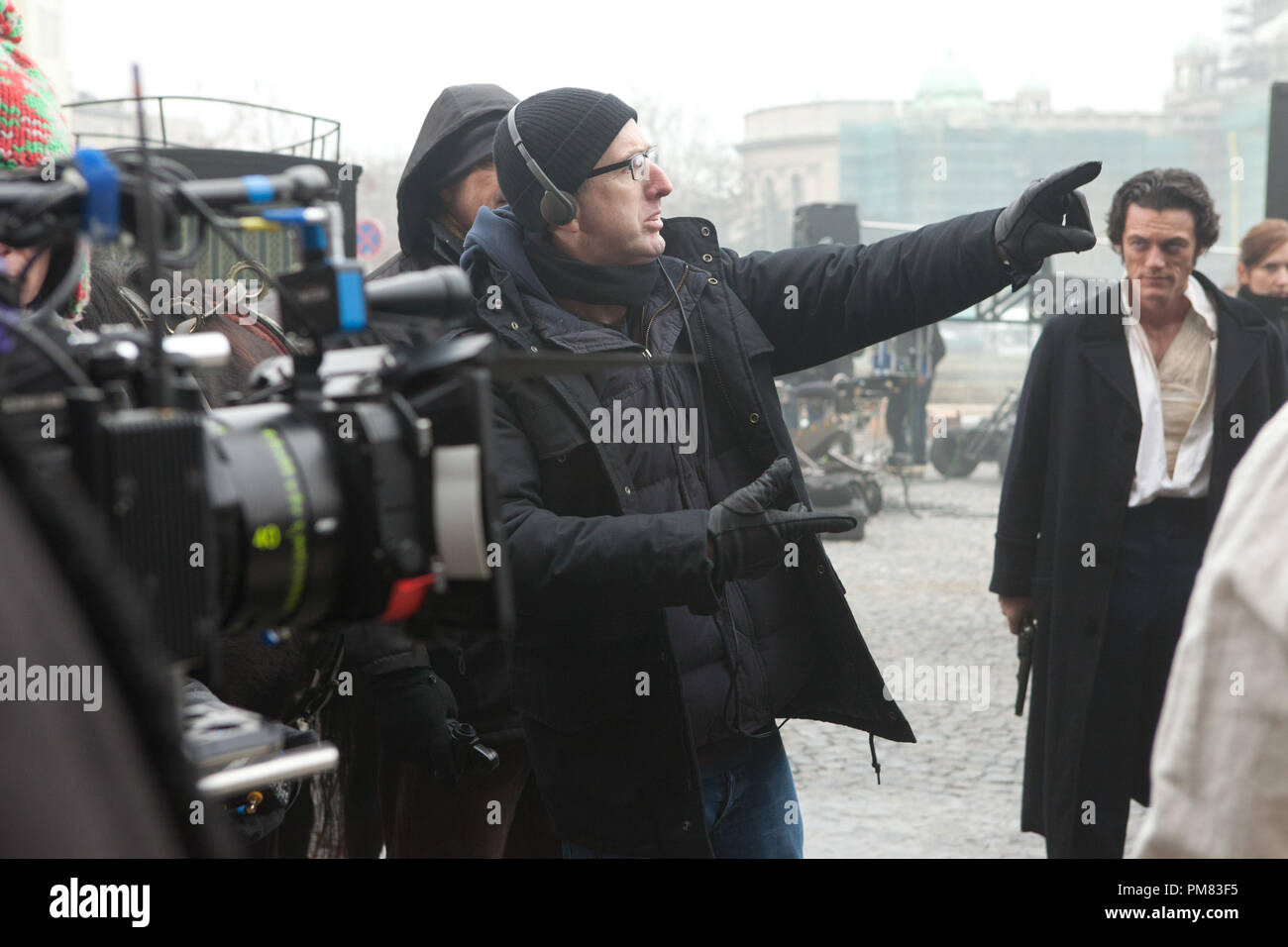 (Left to right.)  Director James McTeigue discusses a scene with star Luke Evans on the set of Relativity Media's stylish gothic thriller The Raven. Stock Photo